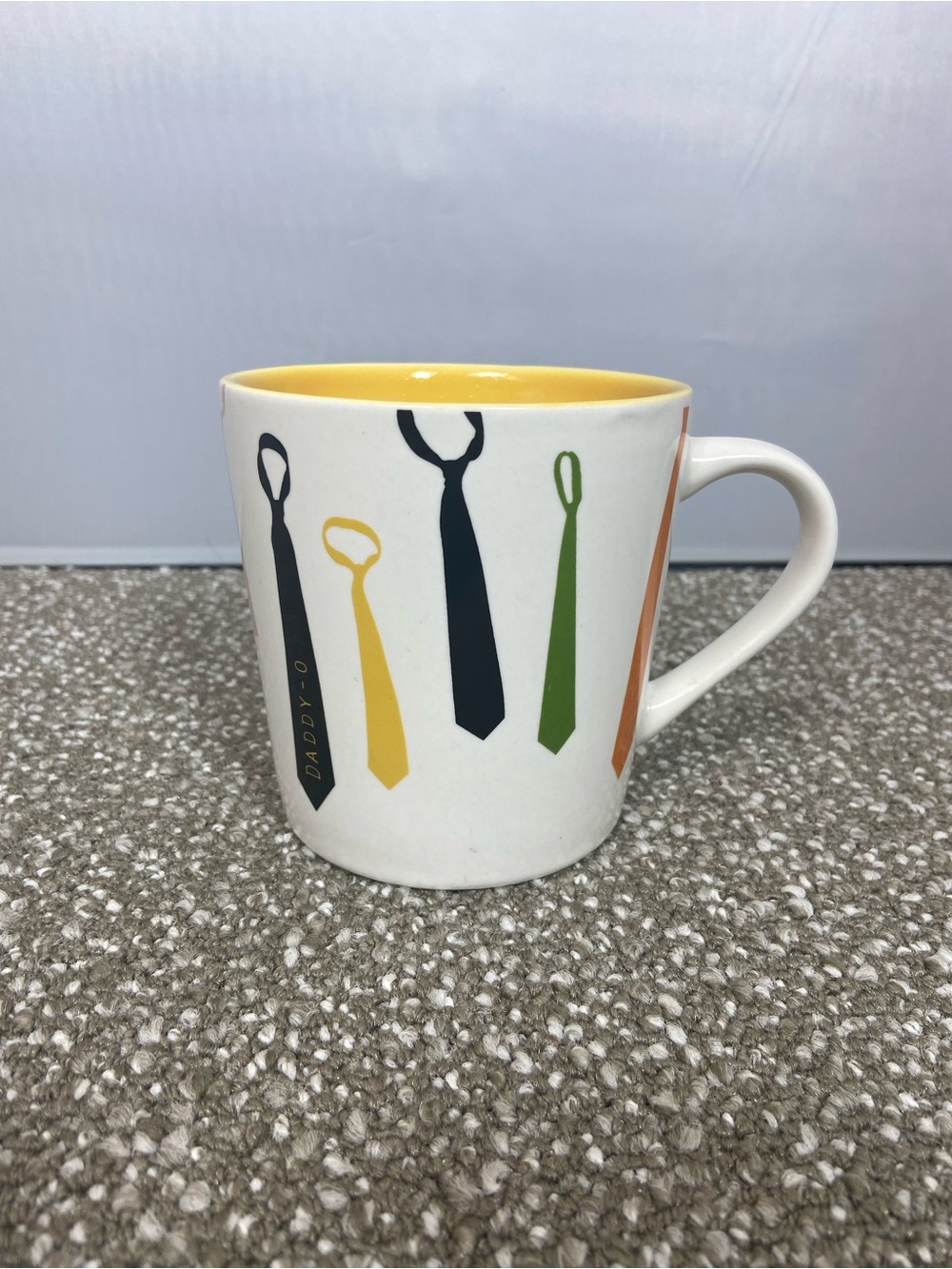 Star Bucks Daddy- O-Pops White Mug with Yellow Interior and Neckties Tie Design.